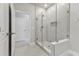 Modern bathroom featuring glass-enclosed shower, sleek gray tiles, and a convenient inset shelf at 445 31St N Way, St Petersburg, FL 33713
