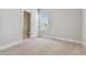 A light and bright bedroom with carpeted floor, and a view to an en suite bathroom at 445 31St N Way, St Petersburg, FL 33713