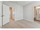A bedroom showcases neutral walls, carpeting, and multiple entryways, creating a spacious and versatile atmosphere at 445 31St N Way, St Petersburg, FL 33713