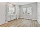 Light filled dining area with white cabinets, quartz countertops, and two windows at 445 31St N Way, St Petersburg, FL 33713