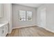Dining area features two windows, white cabinets with countertops, and neutral paint at 445 31St N Way, St Petersburg, FL 33713