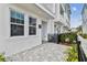 Townhouse exterior showcasing the private patio area, modern architecture, and address marker at 445 31St N Way, St Petersburg, FL 33713