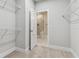 Walk-in closet with wire shelving, carpet, and a door leading to an en suite bathroom at 445 31St N Way, St Petersburg, FL 33713
