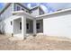 Covered porch area with large columns, offering an inviting outdoor space for relaxation and entertaining at 5001 21St N Ave, St Petersburg, FL 33710
