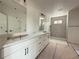 Elegant bathroom with a double vanity, tile shower, and modern fixtures at 5001 21St N Ave, St Petersburg, FL 33710
