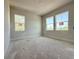 Bright bedroom with three windows offering plenty of natural light, and neutral walls at 5001 21St N Ave, St Petersburg, FL 33710