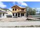Two-story home under construction with blue sky and scattered clouds in the background at 5001 21St N Ave, St Petersburg, FL 33710