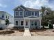 Charming two-story home featuring a stone accent facade, well-manicured lawn and tasteful landscaping at 5001 21St N Ave, St Petersburg, FL 33710