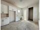Open-concept kitchen area featuring white cabinetry and a built-in desk at 5001 21St N Ave, St Petersburg, FL 33710