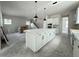 Expansive open kitchen layout with a large center island and modern white cabinetry at 5001 21St N Ave, St Petersburg, FL 33710