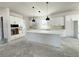 Spacious kitchen featuring white cabinets, a center island, and modern pendant lighting at 5001 21St N Ave, St Petersburg, FL 33710