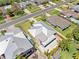 Aerial view showcases metal roof and large paver patio and wood pergola in the backyard at 5731 Denver Ne St, St Petersburg, FL 33703