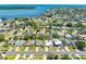 Aerial view of the neighborhood with the subject property having a metal roof and paver patio at 5731 Denver Ne St, St Petersburg, FL 33703
