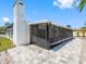 Charming enclosed patio area with pavers and a screen enclosure at 5731 Denver Ne St, St Petersburg, FL 33703