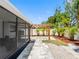 The beautiful backyard featuring a wooden pergola, landscaped plantings and a paver walkway at 5731 Denver Ne St, St Petersburg, FL 33703