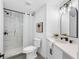 Modern bathroom featuring a walk-in shower with black fixtures and updated vanity at 5731 Denver Ne St, St Petersburg, FL 33703