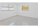 Empty bedroom showcasing marble floors and windows for natural light at 5731 Denver Ne St, St Petersburg, FL 33703