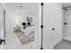 Bedroom view from doorway, featuring ensuite bath and modern decor at 5731 Denver Ne St, St Petersburg, FL 33703