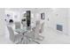 Stylish dining room with sleek glass table, open layout, and modern decor at 5731 Denver Ne St, St Petersburg, FL 33703