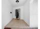 Welcoming entryway featuring a 'hello' rug and sleek wood-look flooring at 5731 Denver Ne St, St Petersburg, FL 33703