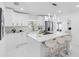 Modern kitchen with stainless steel appliances, white cabinets, and a center island with seating at 5731 Denver Ne St, St Petersburg, FL 33703