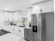 Bright kitchen with white cabinets, stainless steel appliances, and modern fixtures at 5731 Denver Ne St, St Petersburg, FL 33703
