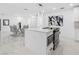 Bright kitchen with white cabinets, stainless steel appliances, and a marble floor at 5731 Denver Ne St, St Petersburg, FL 33703