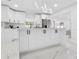 Modern kitchen features white cabinetry, stainless appliances, and stylish pendant lighting at 5731 Denver Ne St, St Petersburg, FL 33703