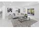 Cozy living room with modern decor and view into the kitchen and patio area at 5731 Denver Ne St, St Petersburg, FL 33703