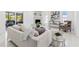 Bright living room with fireplace, modern furniture, and outdoor patio access at 5731 Denver Ne St, St Petersburg, FL 33703