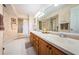 Bathroom featuring a double vanity with modern fixtures and a separate shower and toilet area at 6077 Bahia Del Mar Blvd # 123, St Petersburg, FL 33715