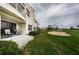 Exterior view of condo with patio, green grass, plants and golf course view at 6077 Bahia Del Mar Blvd # 123, St Petersburg, FL 33715
