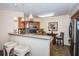 Kitchen featuring stainless steel appliances, breakfast bar, and pendant lighting at 6077 Bahia Del Mar Blvd # 123, St Petersburg, FL 33715