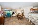 Open-concept living space featuring tile floors and an outdoor view of the golf course at 6077 Bahia Del Mar Blvd # 123, St Petersburg, FL 33715