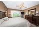 Well-lit main bedroom featuring a golf course view, carpet, and neutral paint at 6077 Bahia Del Mar Blvd # 123, St Petersburg, FL 33715