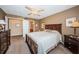 Cozy main bedroom featuring traditional furnishings and an ensuite bathroom at 6077 Bahia Del Mar Blvd # 123, St Petersburg, FL 33715