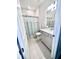 Bright bathroom with vanity, toilet, and bathtub/shower combination behind a curtain at 6293 Bradford Woods Dr, Zephyrhills, FL 33542