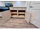 Base kitchen cabinets with convenient pull-out shelving for storing kitchen accessories and cookware at 6293 Bradford Woods Dr, Zephyrhills, FL 33542