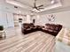 Open-concept living room showcases a modern design, seamlessly connecting to the kitchen for easy entertaining at 6293 Bradford Woods Dr, Zephyrhills, FL 33542