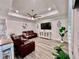 Comfortable living room featuring recessed lighting, ceiling fan, and a wall mounted television at 6293 Bradford Woods Dr, Zephyrhills, FL 33542