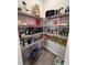 Walk-in pantry with wire shelving, providing ample storage space for food and kitchen essentials at 6293 Bradford Woods Dr, Zephyrhills, FL 33542