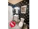 Bathroom showcases bee-themed wallpaper, with modern vanity and fixtures at 7101 N 9Th St, Tampa, FL 33604