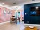 Bright open-concept dining room with modern lighting and a stylish dining table at 7101 N 9Th St, Tampa, FL 33604