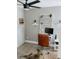 Bright home office with wood-look floors and a modern decorative ladder at 7101 N 9Th St, Tampa, FL 33604