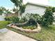 Landscaped backyard pond featuring a waterfall and water lilies at 7101 N 9Th St, Tampa, FL 33604