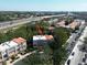 Aerial view of townhome featuring a tile roof in a community near a highway at 805 100Th N Ave, St Petersburg, FL 33702