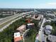 Aerial view showcases community nestled in a lush setting, easy access to the highway, and convenient nearby amenities at 805 100Th N Ave, St Petersburg, FL 33702