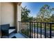 View from the balcony overlooking the street and mature trees at 805 100Th N Ave, St Petersburg, FL 33702