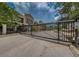 View of the secure gated community entrance showcasing the manicured landscaping and well-maintained grounds at 805 100Th N Ave, St Petersburg, FL 33702