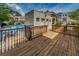 Community pool deck featuring a wooden walkway and multiple points of access for residents and visitors at 805 100Th N Ave, St Petersburg, FL 33702